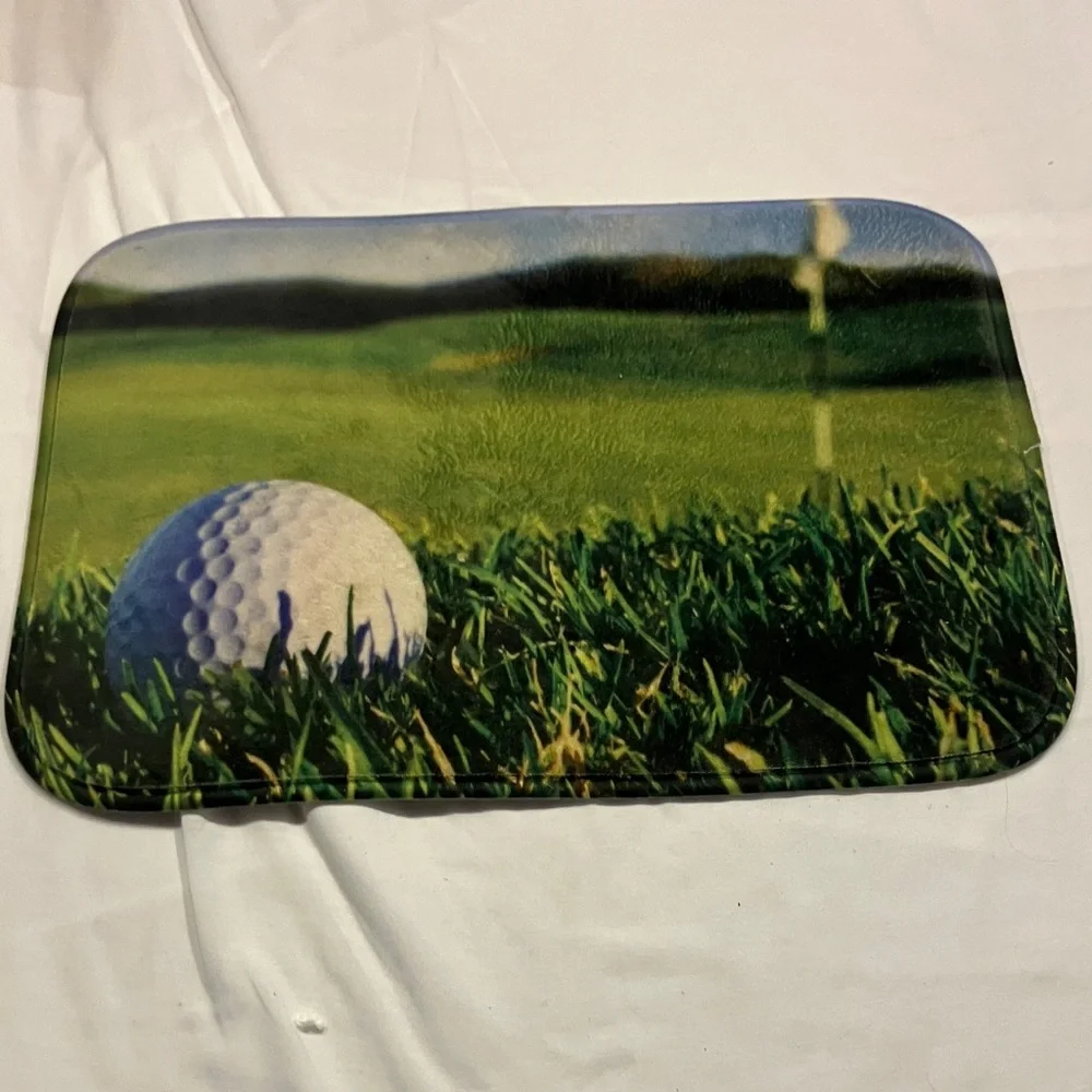Golf Ball and Green Grass Mat
